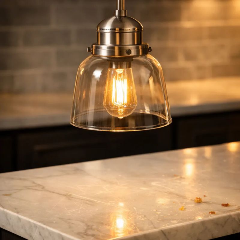 Electrician repairing a lighting fixture and wall outlet in a Houston home